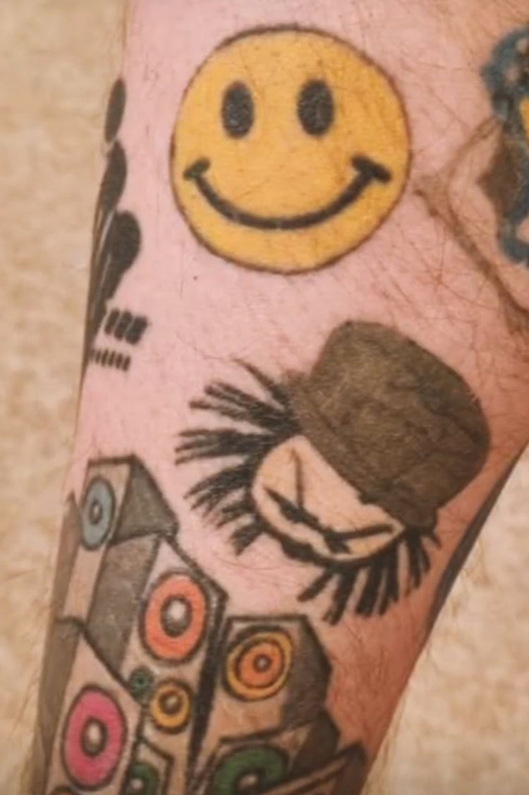 Dready tattoos on an arm