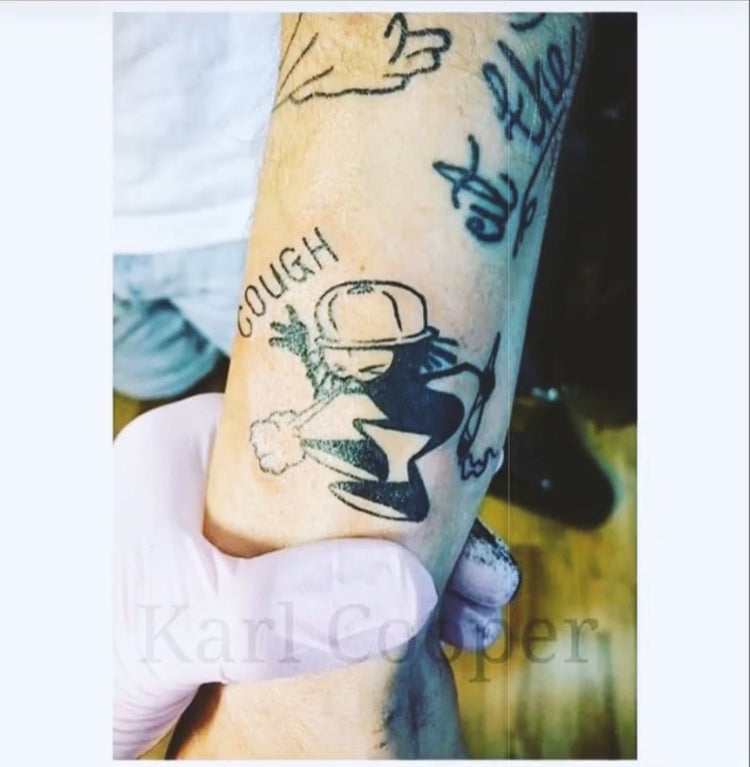 Dready line tattoo on a forearm