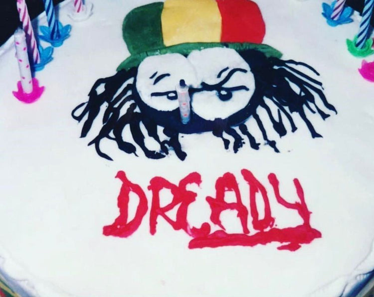 Dready celebration cake with red lettering