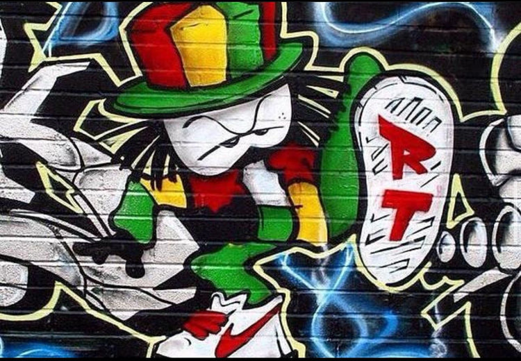 Close-up of a Dready mural in Rasta colours