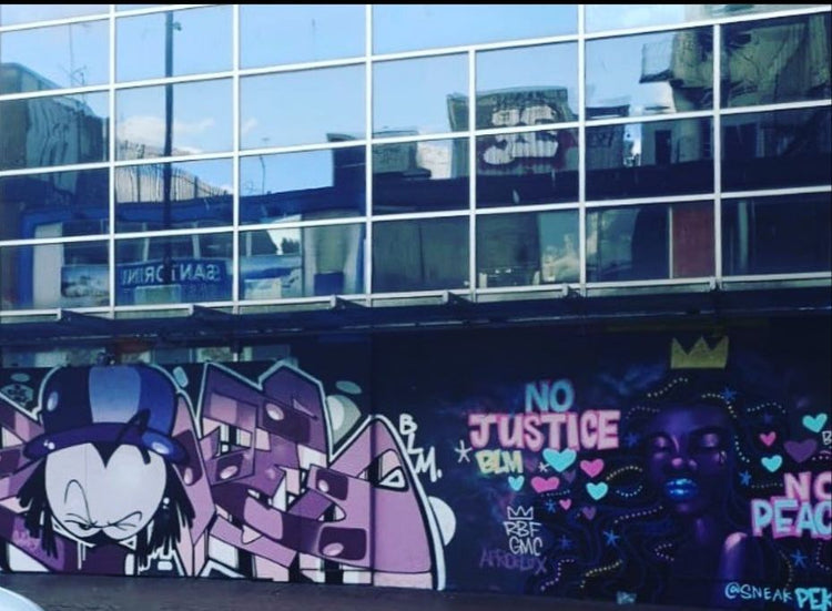 Dready mural on a building wall