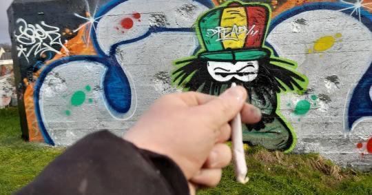 Dready character mural on a white wall